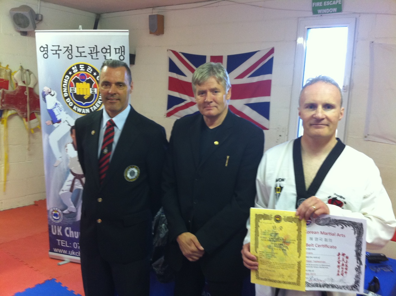 Master Evans receives his 6th Dan from Master Andrew Davies (8th Dan) and Master Michael McGavin (7th Dan)
